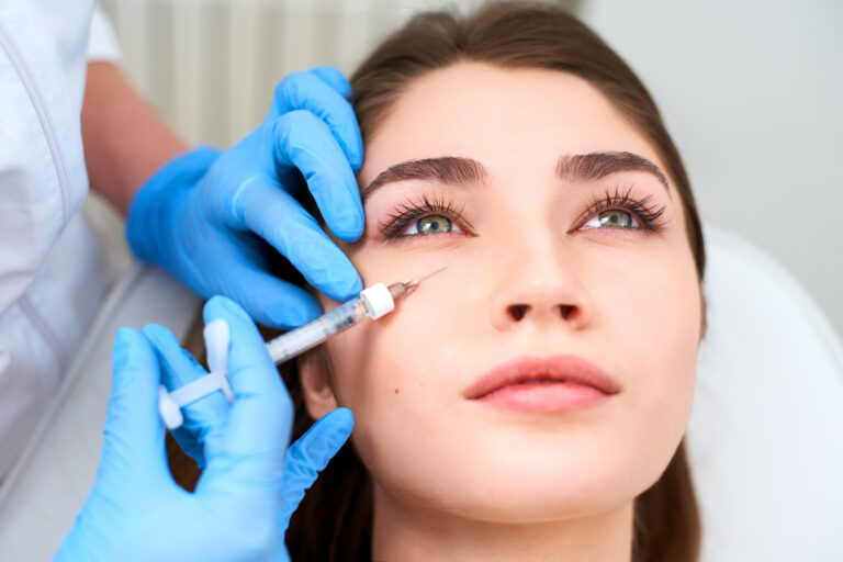 woman receiving filler injection in face