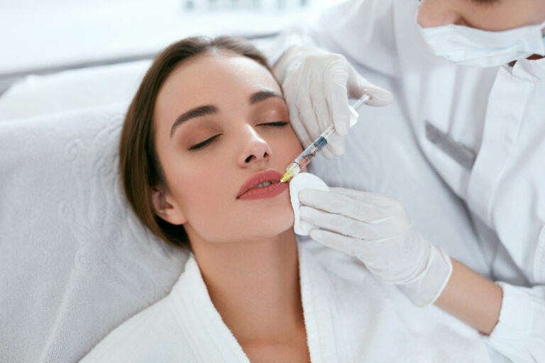 woman getting beauty injection in lips